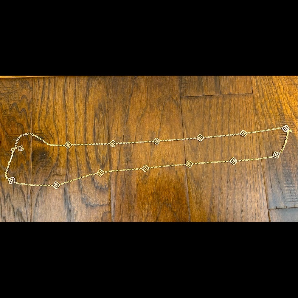 Kendra Scott gold long necklace logo